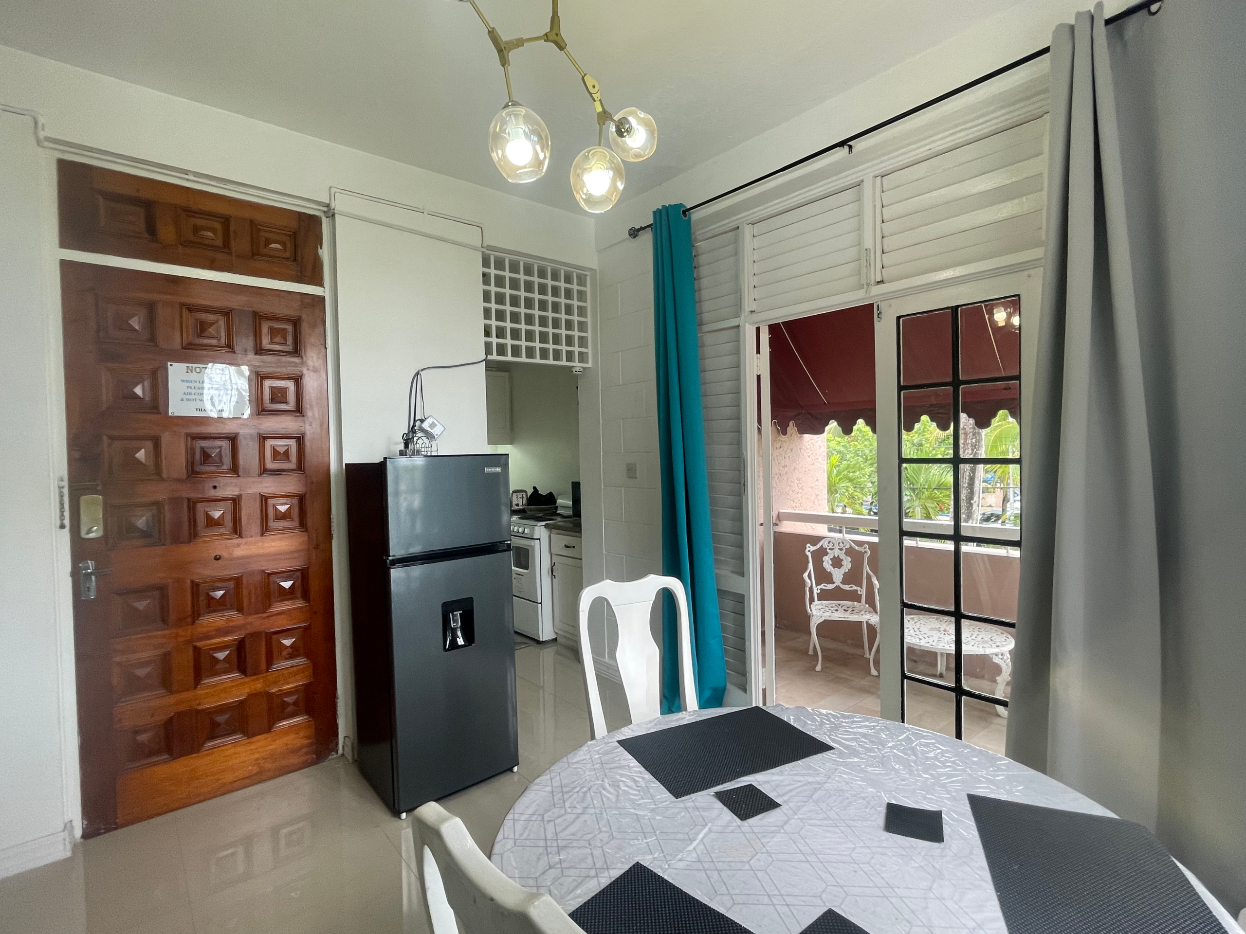 Dining area and kitchen at Ochi50 apartment in Ocho Rios